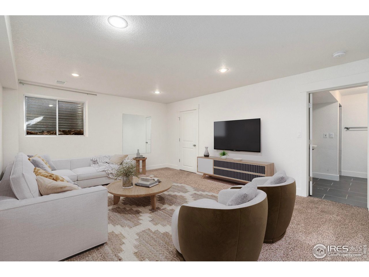 3036 Regatta Lane, Unit 2 Fort Collins, CO 80525 - Photo 14 of 22 Basement Family room - Virtually Staged