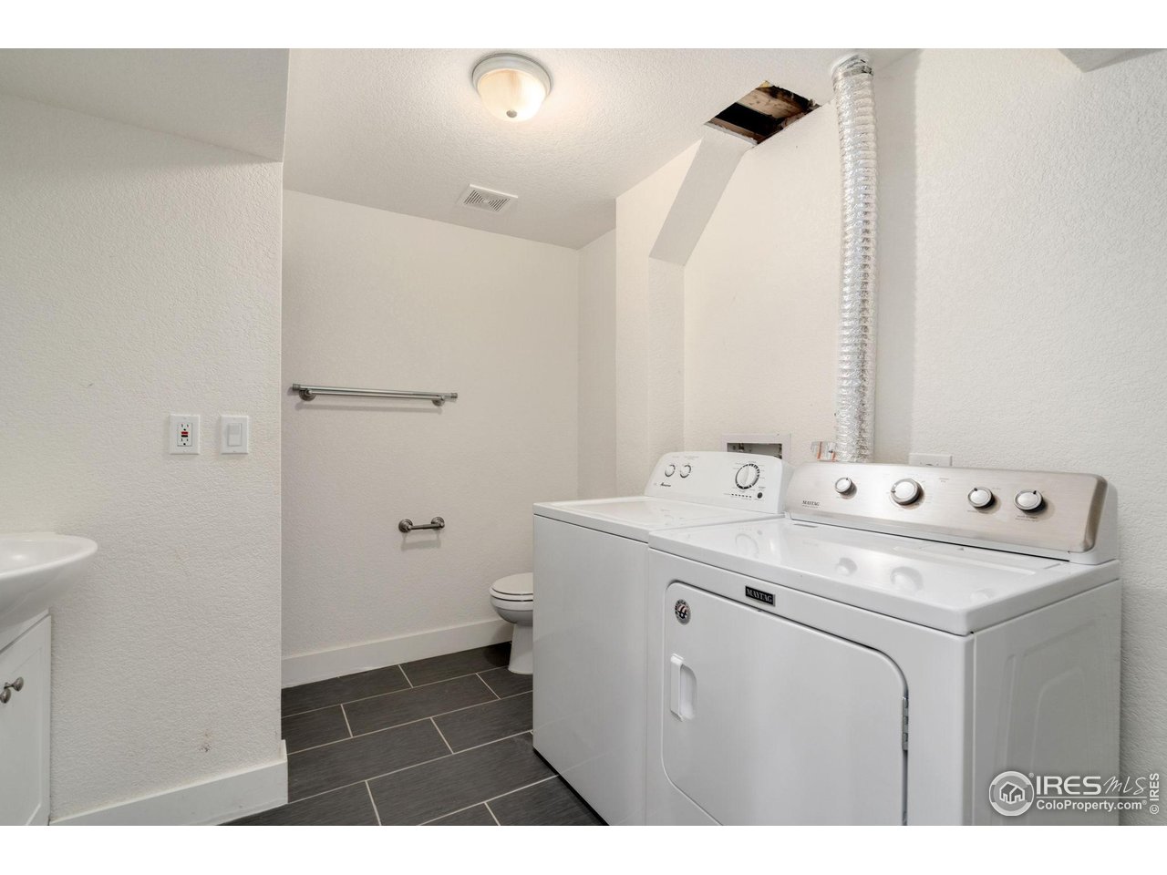 3036 Regatta Lane, Unit 2 Fort Collins, CO 80525 - Photo 15 of 22 Downstairs Laundry and 3/4 Bath