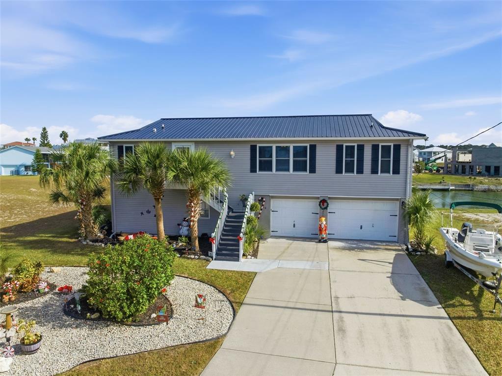3366 Bluefish Drive Hernando Beach, FL 34607 - Photo 36 of 75 front view of a house with a swimming pool