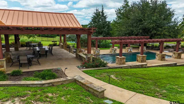 an aerial view of a golf course with parking space