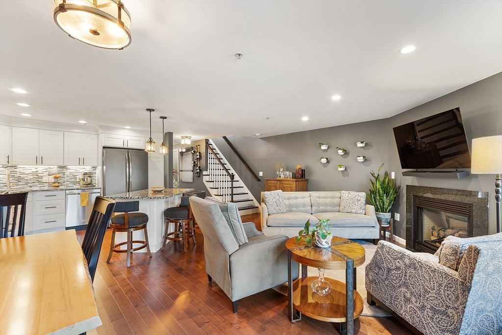 7 Green Briar Road, Unit 7 Fitchburg, MA 01420 - Photo 12 of 34 a living room with fireplace furniture and a flat screen tv