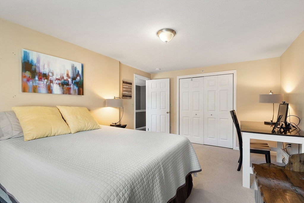 7 Green Briar Road, Unit 7 Fitchburg, MA 01420 - Photo 26 of 34 a bedroom with a large bed and a table