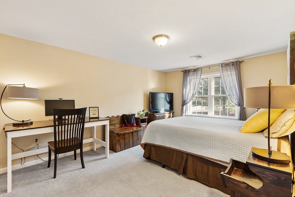 7 Green Briar Road, Unit 7 Fitchburg, MA 01420 - Photo 27 of 34 a bedroom with a bed chair and a large window