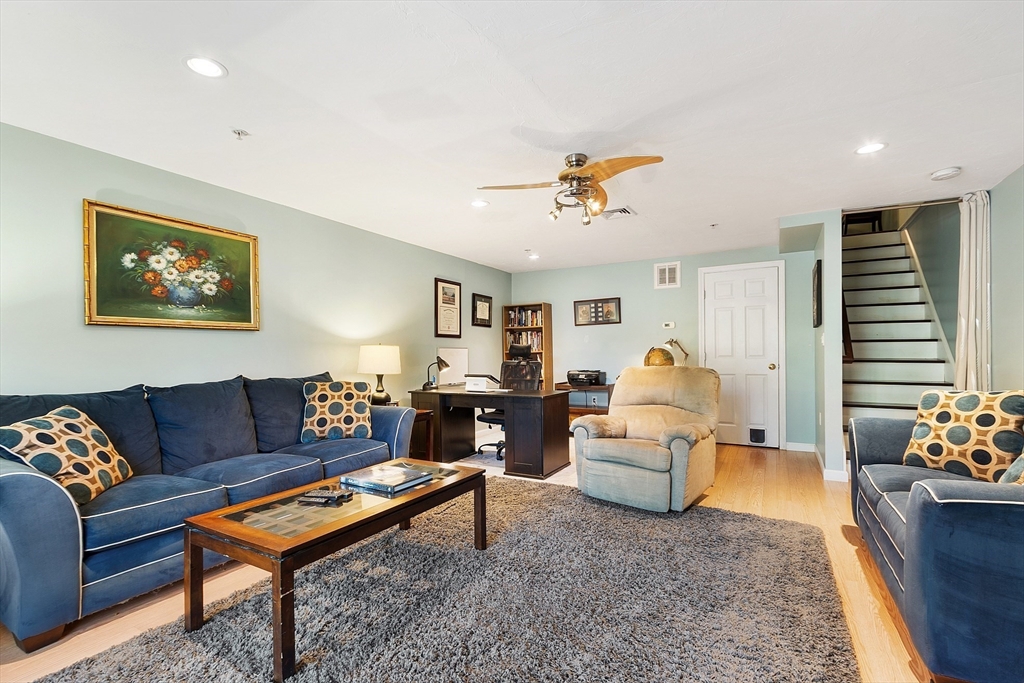 7 Green Briar Road, Unit 7 Fitchburg, MA 01420 - Photo 28 of 34 a living room with furniture and a wooden floor