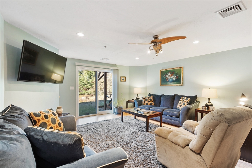 7 Green Briar Road, Unit 7 Fitchburg, MA 01420 - Photo 30 of 34 a living room with furniture and a flat screen tv