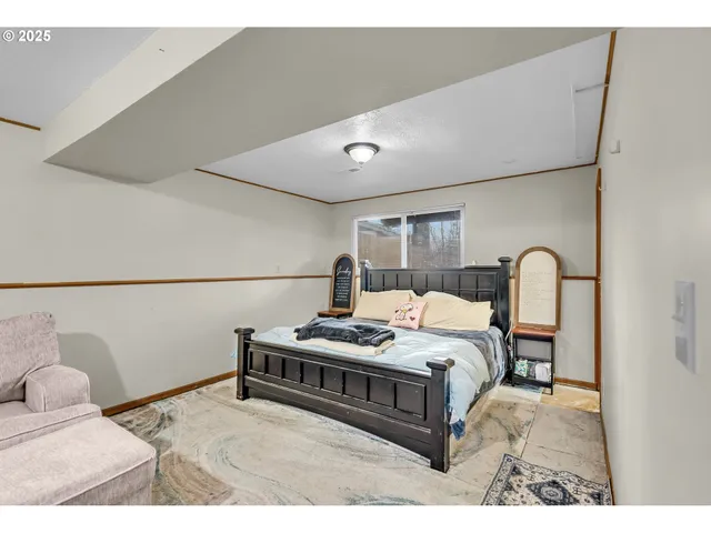 a bedroom with a bed and window