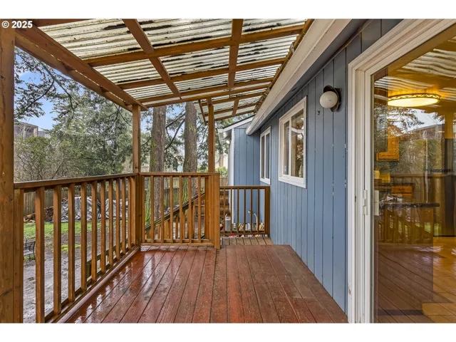 a view of balcony with wooden floor
