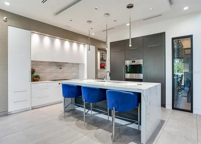 a bathroom with a tub sink shower and a mirror