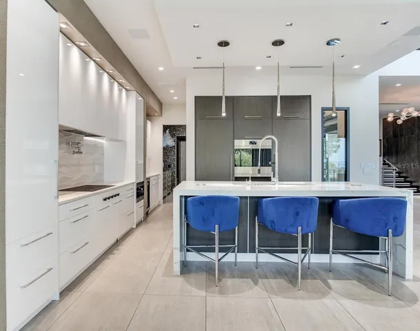 a bedroom with a large bed and a flat tv screen