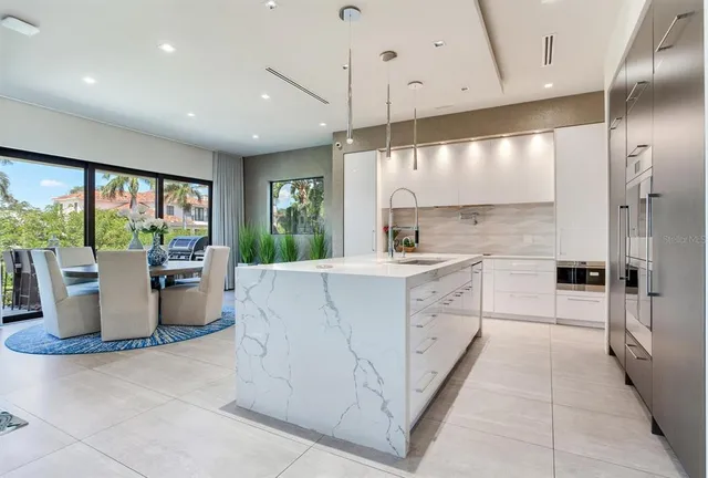 a view of a hallway with wooden floor and windows