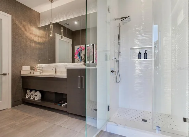 a bed room with a bed and a chair