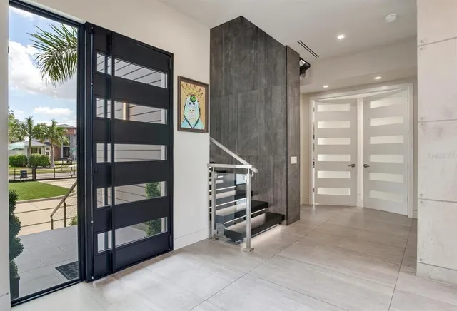 a view of entryway and hall with wooden floor