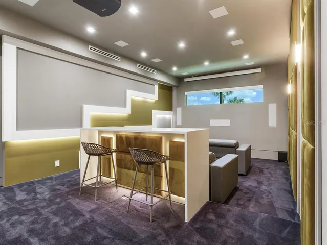 a view of a patio with dining table and chairs