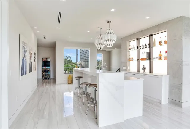 a view of a park with plants and a bench