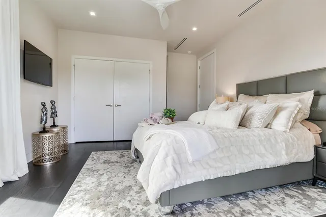 an aerial view of multiple houses with yard