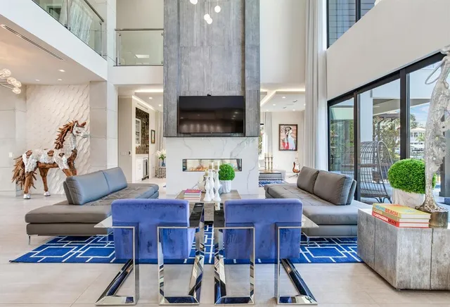 a living room with furniture fireplace and a flat screen tv