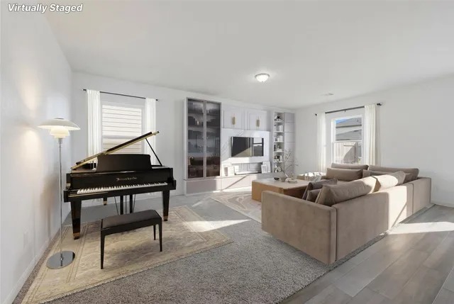 a bedroom with bed and a large window