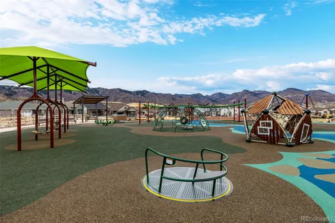 a view of a park with swings and slides