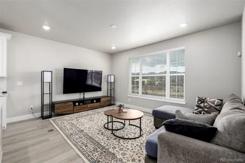 a large white kitchen with lots of counter top space a sink cabinets and appliances