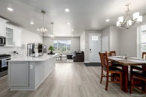 a view of a dining room with furniture window and wooden floor