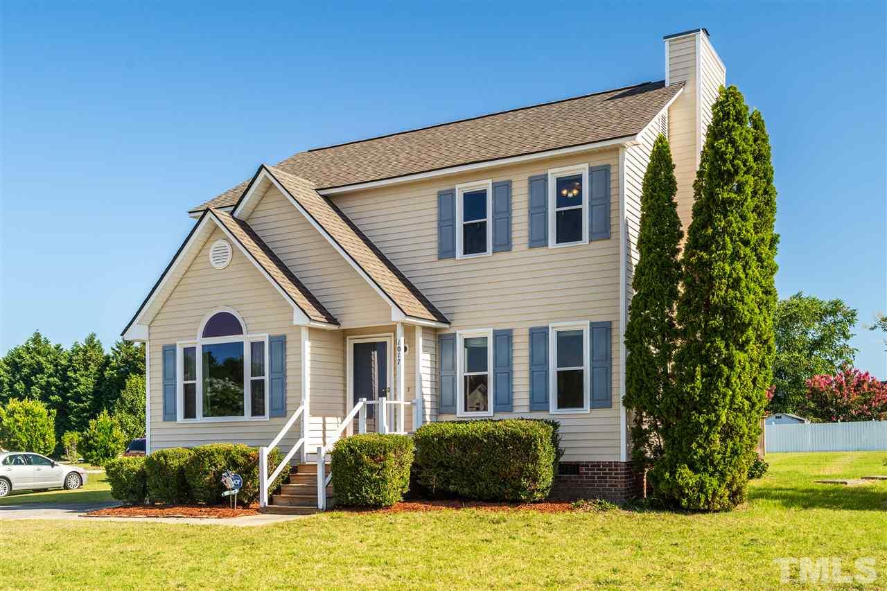 1017 Brack Place Raleigh, NC 27603 - Photo 1 of 24 a front view of a house with garden