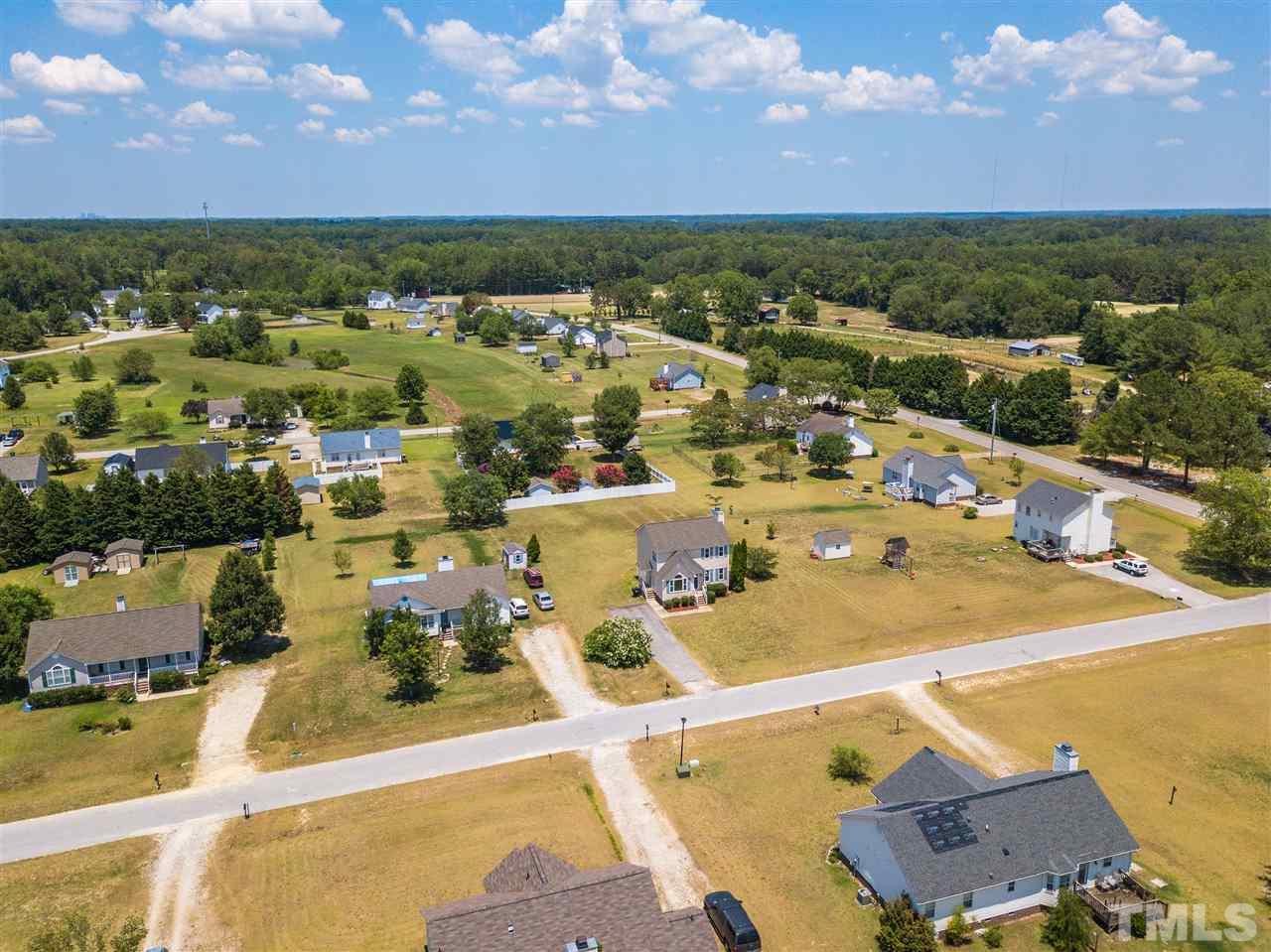 1017 Brack Place Raleigh, NC 27603 - Photo 3 of 24 an aerial view of residential houses with outdoor space