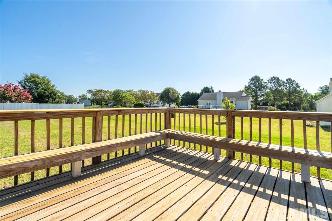 1017 Brack Place Raleigh, NC 27603 - Photo 22 of 24 a view of wooden balcony with outdoor space