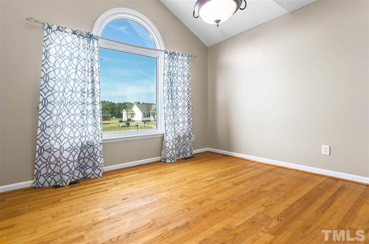 1017 Brack Place Raleigh, NC 27603 - Photo 5 of 24 a view of empty room with window and natural light