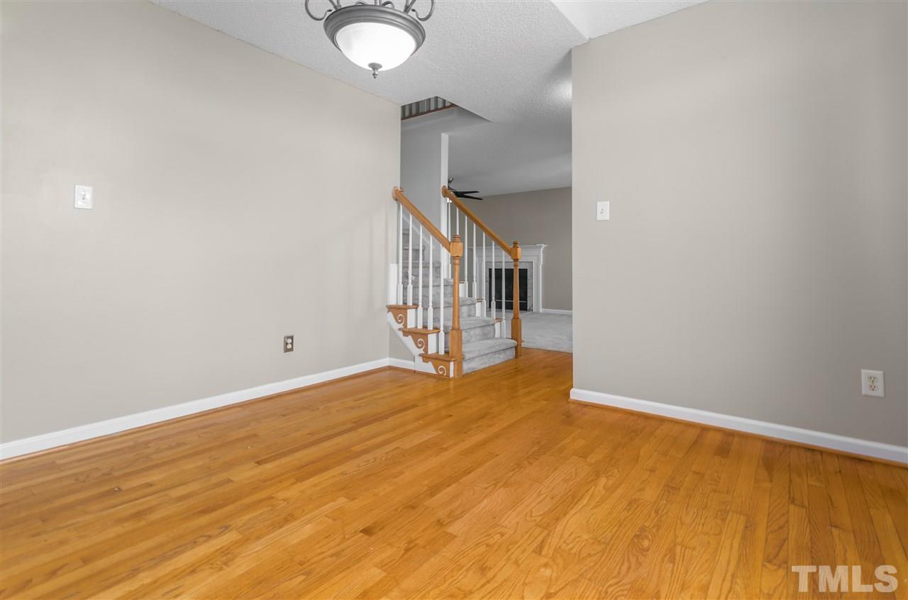 1017 Brack Place Raleigh, NC 27603 - Photo 6 of 24 a view of an empty room with stairs and ventilation