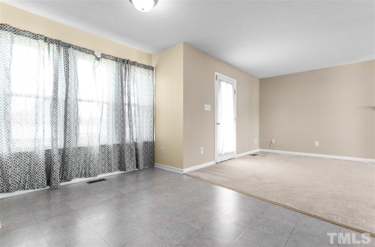 1017 Brack Place Raleigh, NC 27603 - Photo 8 of 24 a view of an empty room with a window