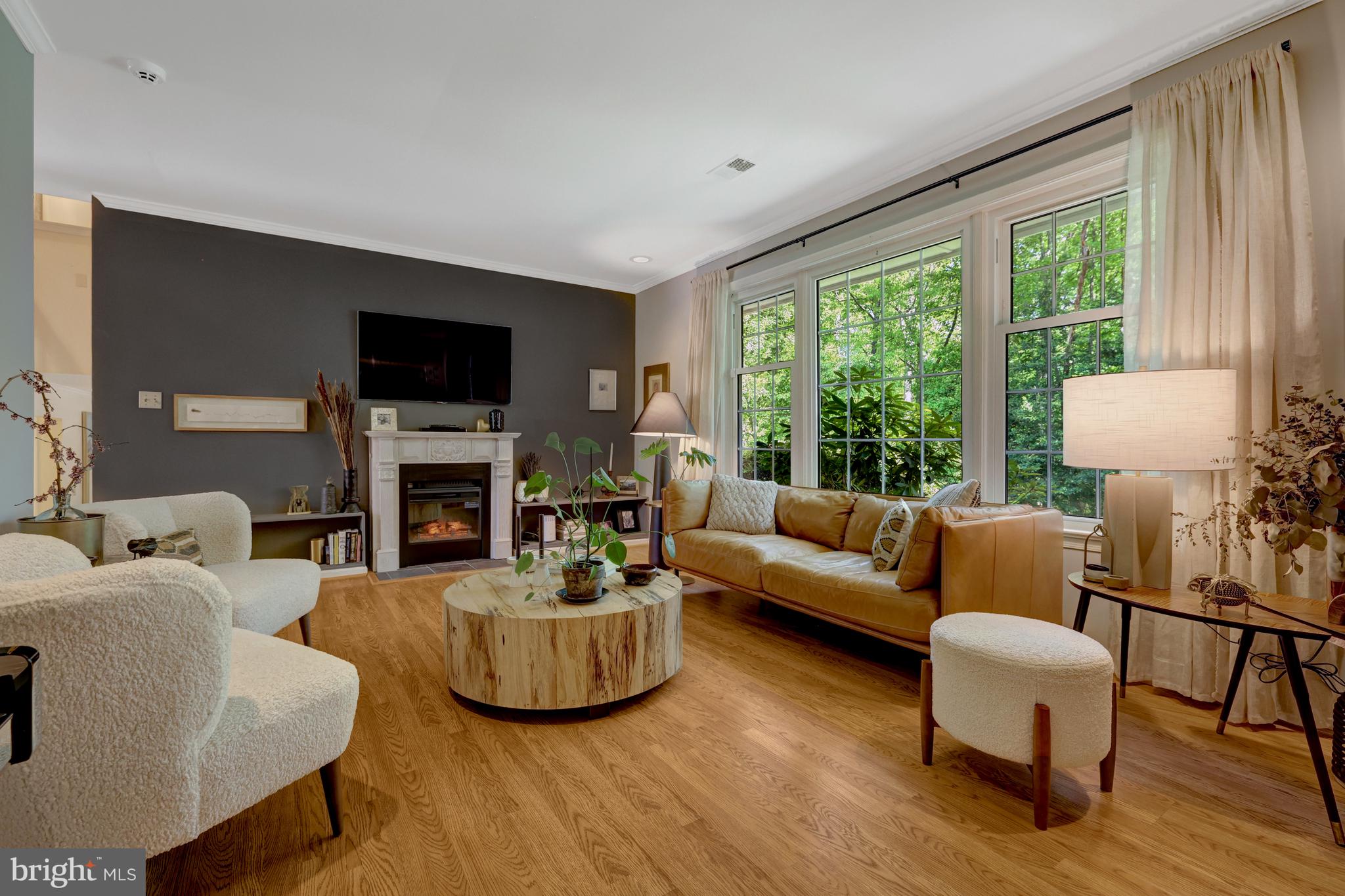 9001 Streamview Lane Vienna, VA 22182 - Photo 12 of 64 a living room with fireplace furniture and a large window