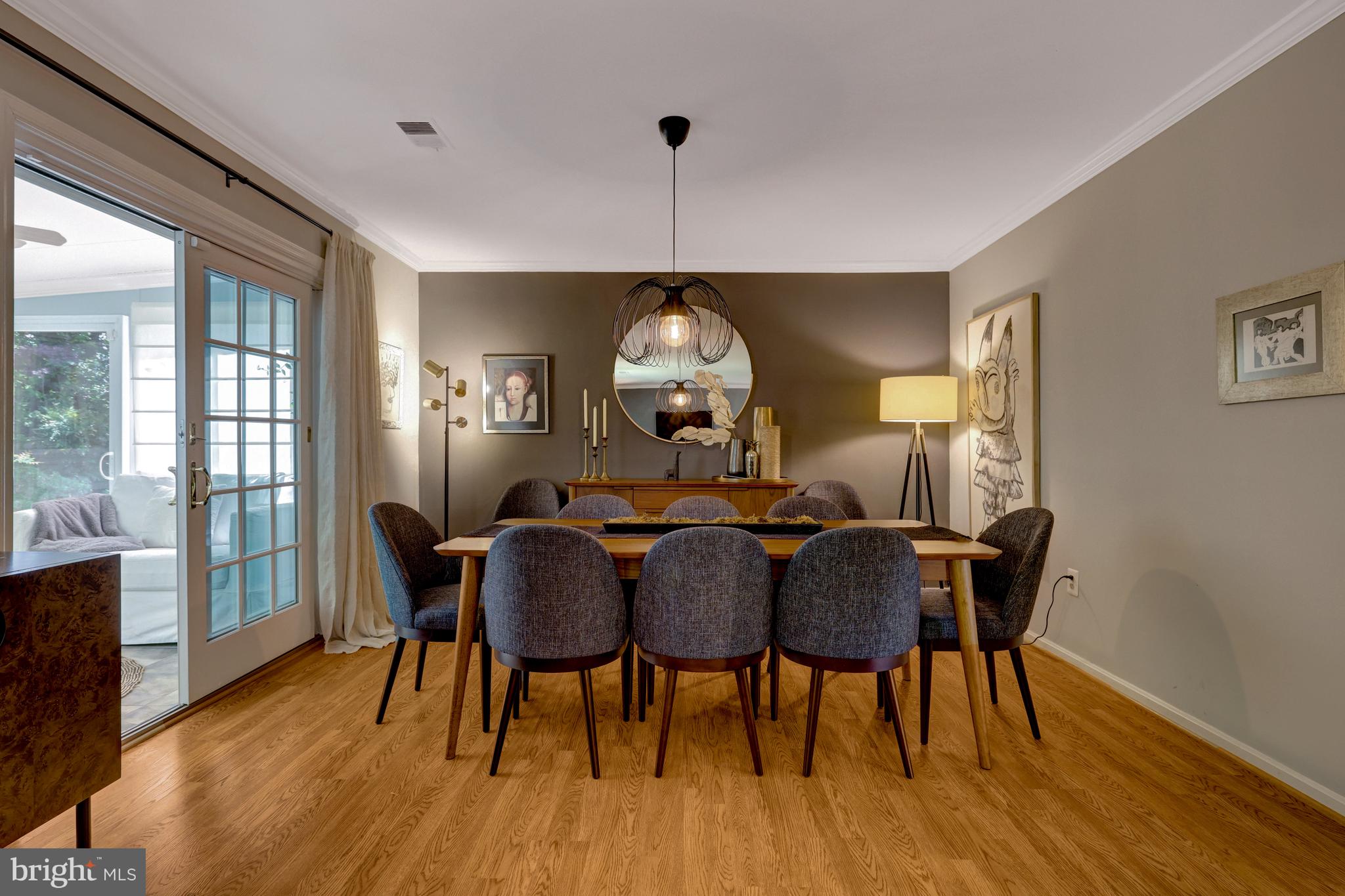 9001 Streamview Lane Vienna, VA 22182 - Photo 15 of 64 a view of a dining room with furniture window and wooden floor