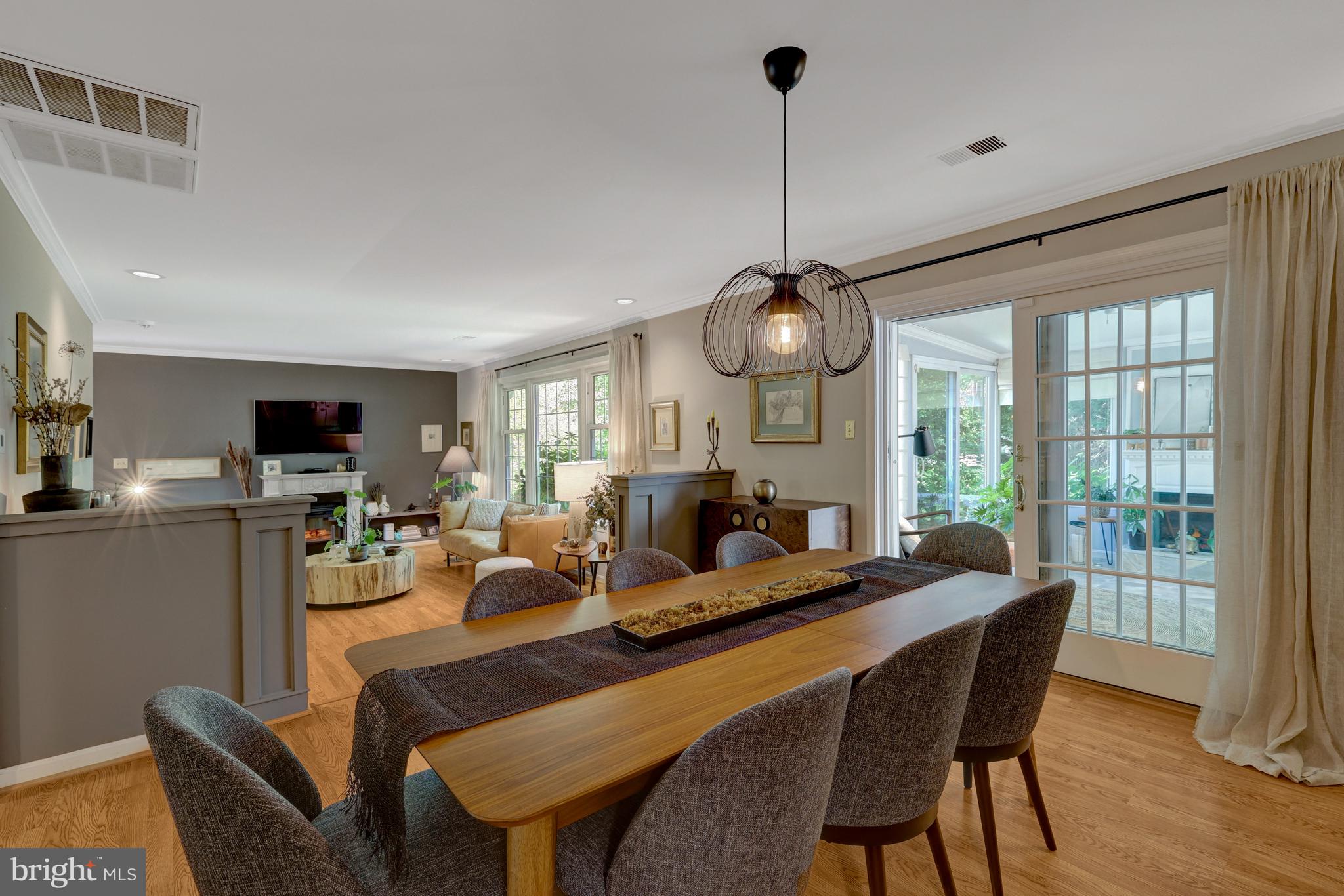 9001 Streamview Lane Vienna, VA 22182 - Photo 16 of 64 a living room with furniture a window and a chandelier