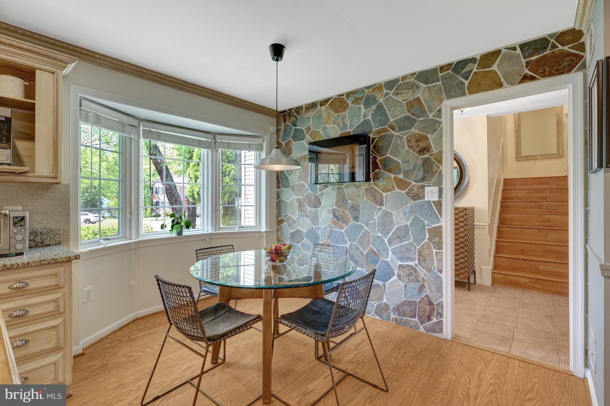 9001 Streamview Lane Vienna, VA 22182 - Photo 23 of 64 a view of a dining room with furniture window and outside view