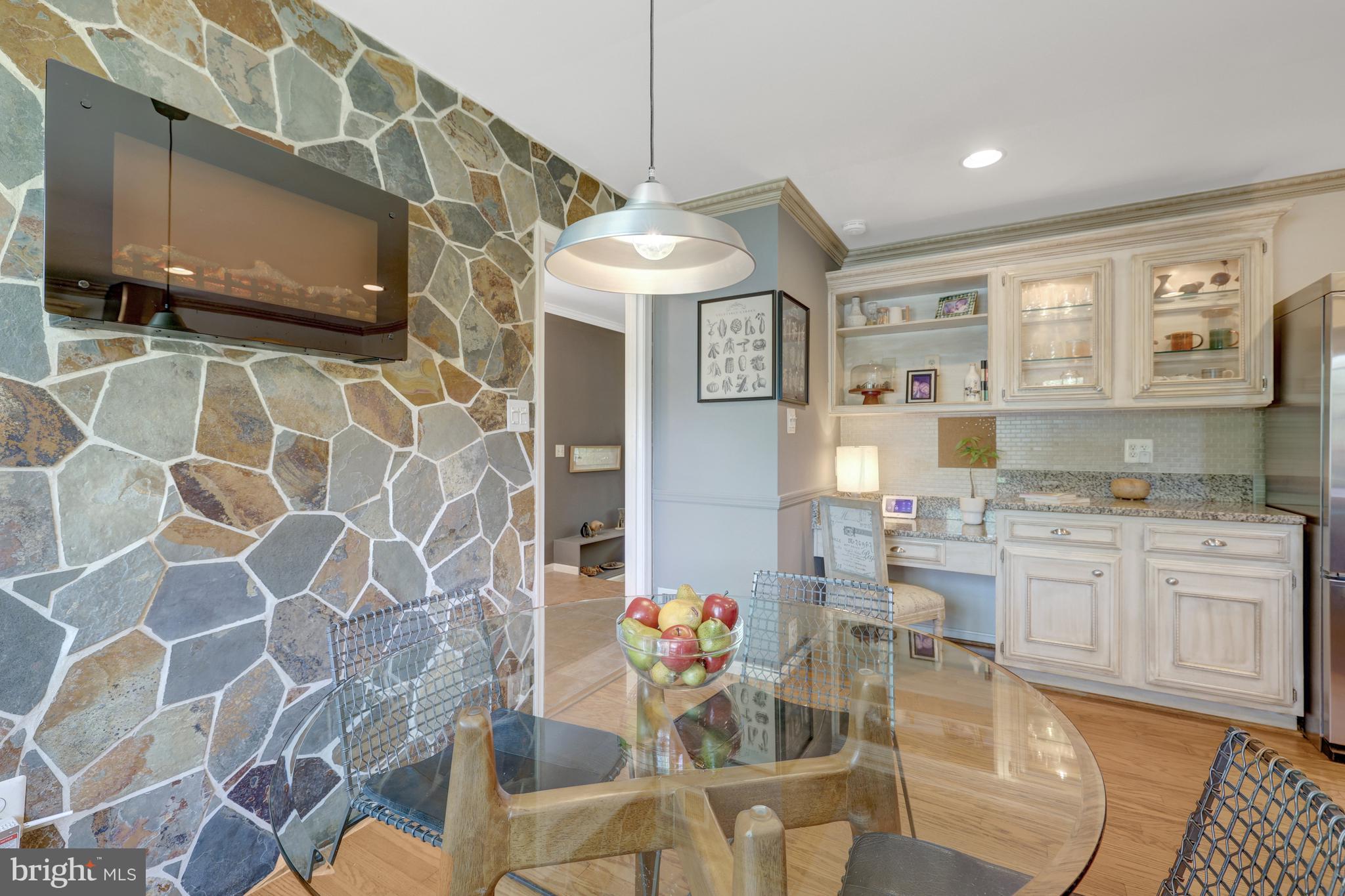 9001 Streamview Lane Vienna, VA 22182 - Photo 24 of 64 a kitchen with stainless steel appliances kitchen island granite countertop a sink and cabinets