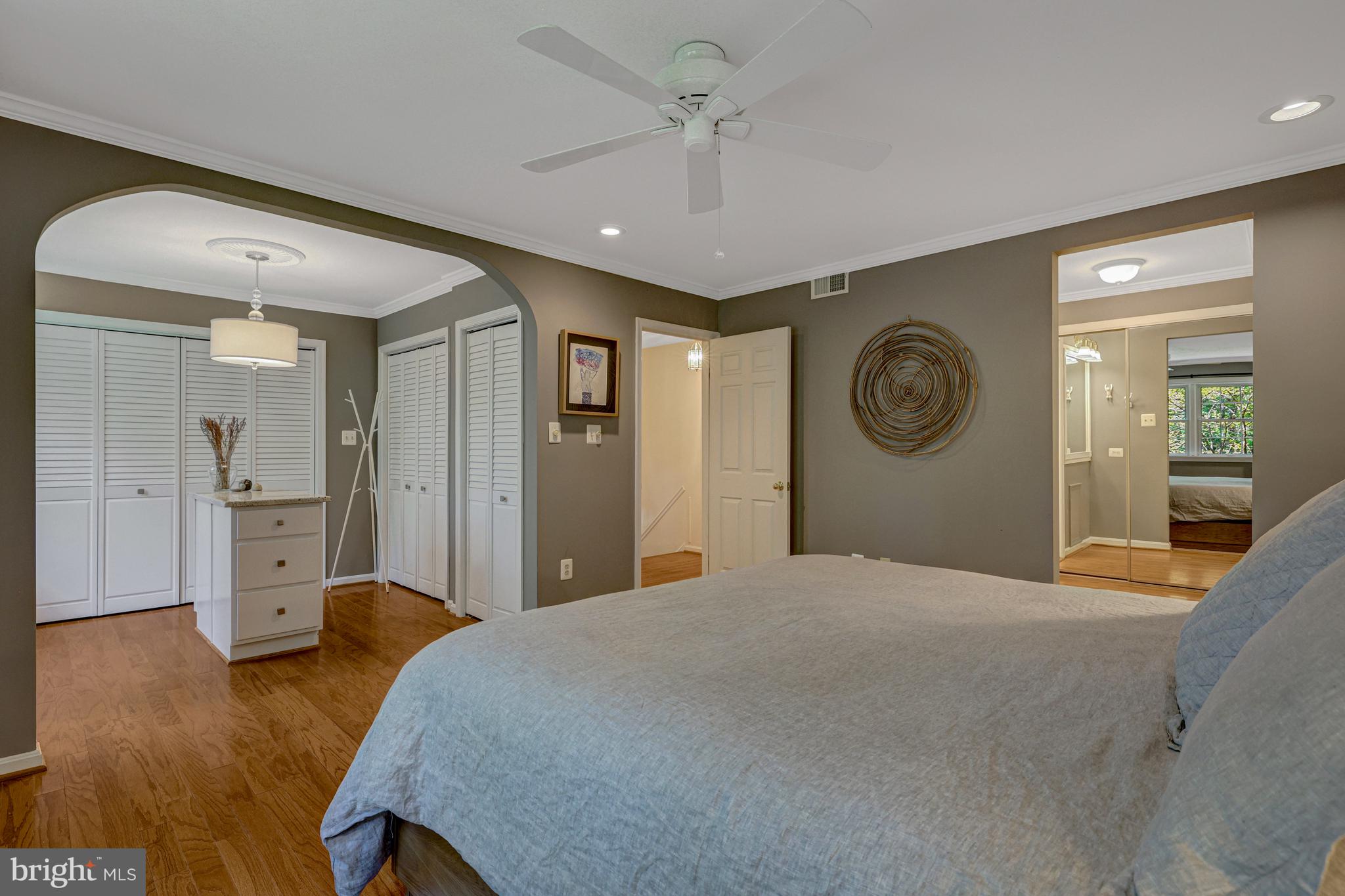 9001 Streamview Lane Vienna, VA 22182 - Photo 31 of 64 a bedroom with a bed and a chandelier