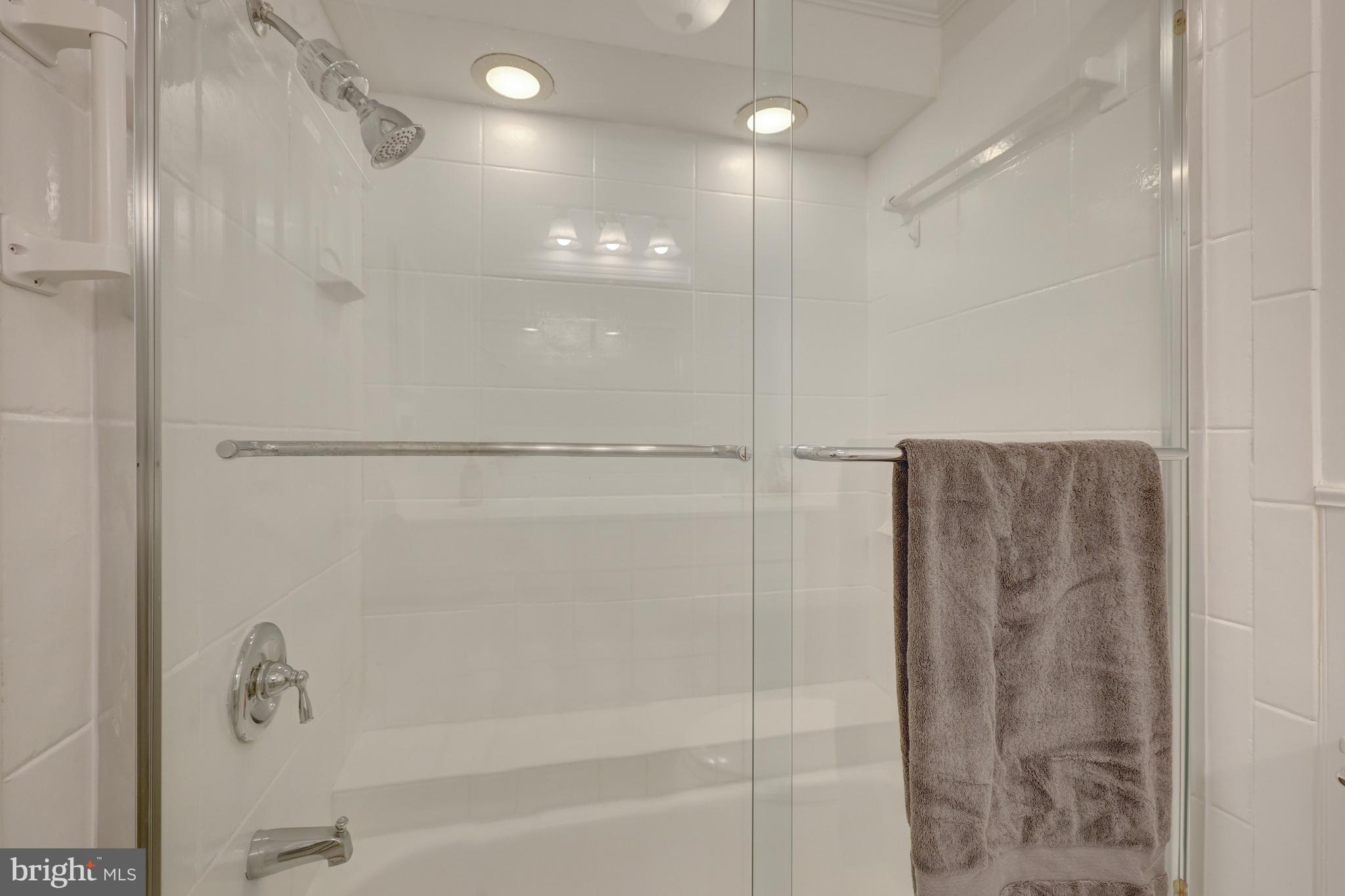 9001 Streamview Lane Vienna, VA 22182 - Photo 36 of 64 a bathroom with a shower and a glass door