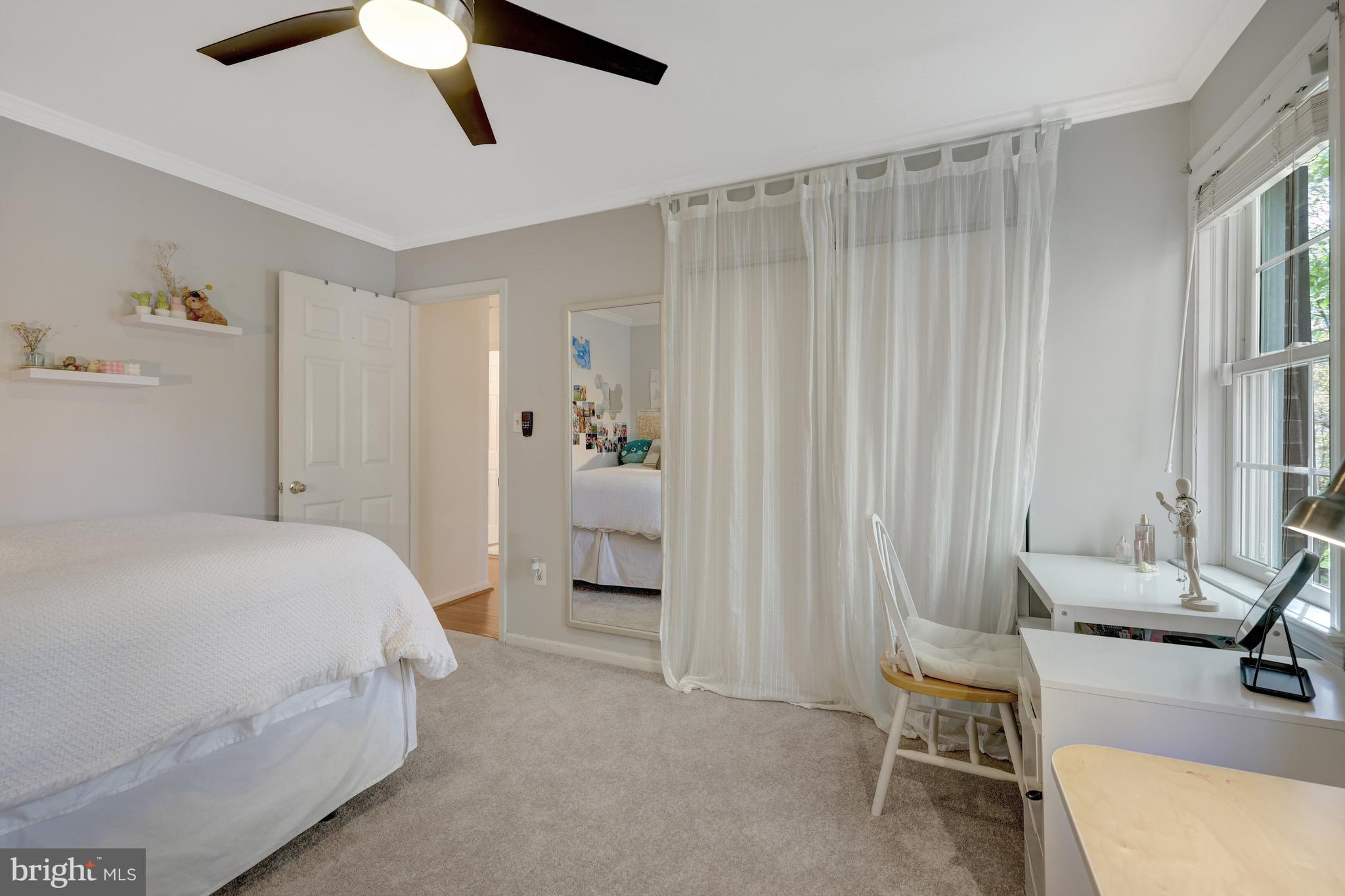 9001 Streamview Lane Vienna, VA 22182 - Photo 38 of 64 a bedroom with a bed and a chair