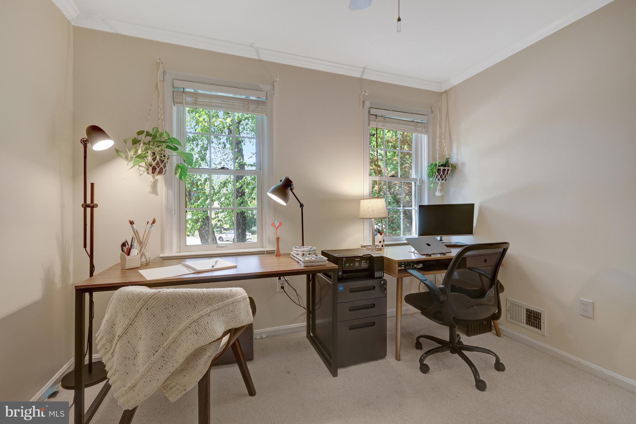 9001 Streamview Lane Vienna, VA 22182 - Photo 40 of 64 a view of a workspace with furniture and a window
