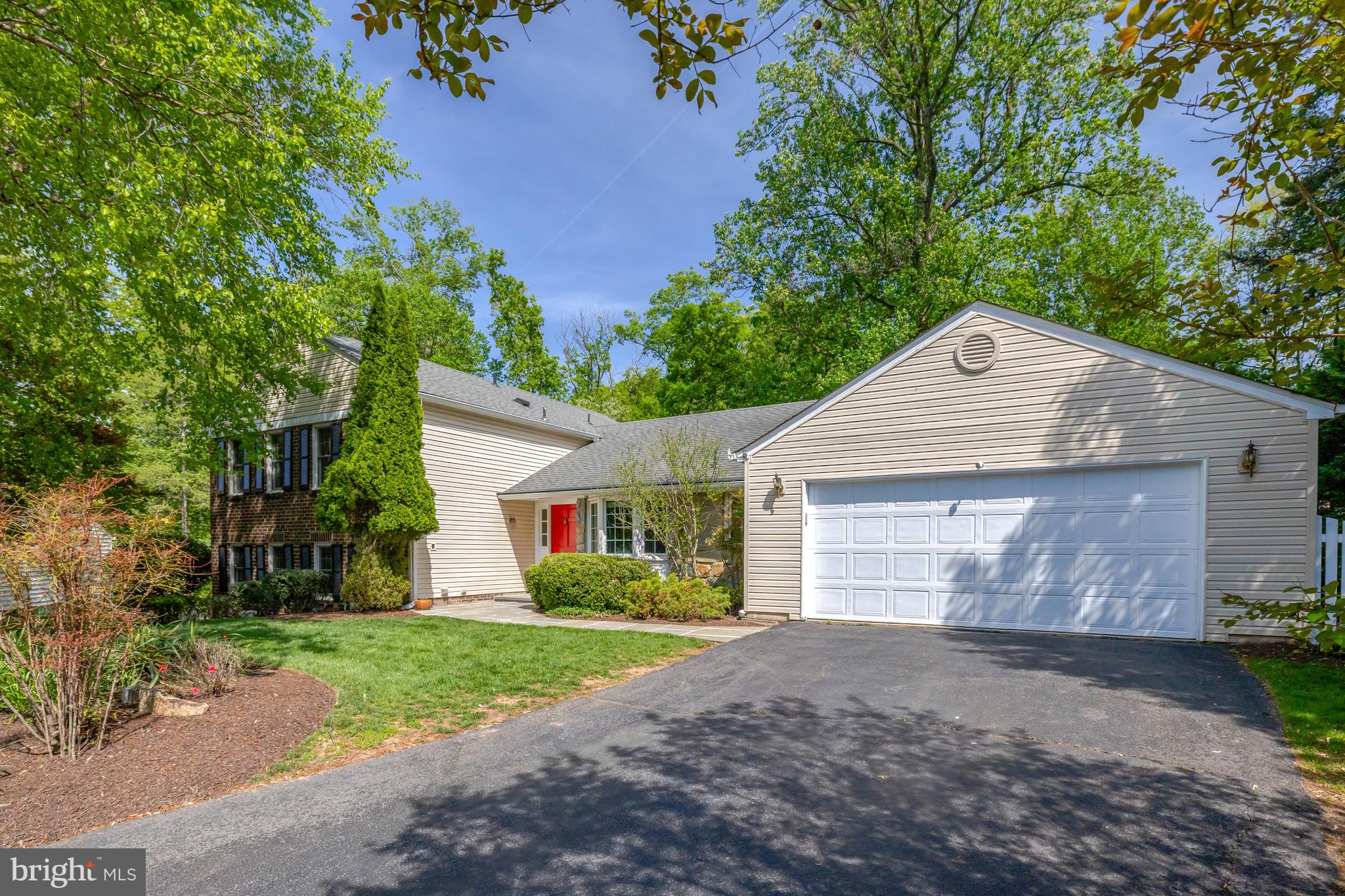 9001 Streamview Lane Vienna, VA 22182 - Photo 4 of 64 a front view of house with yard and trees