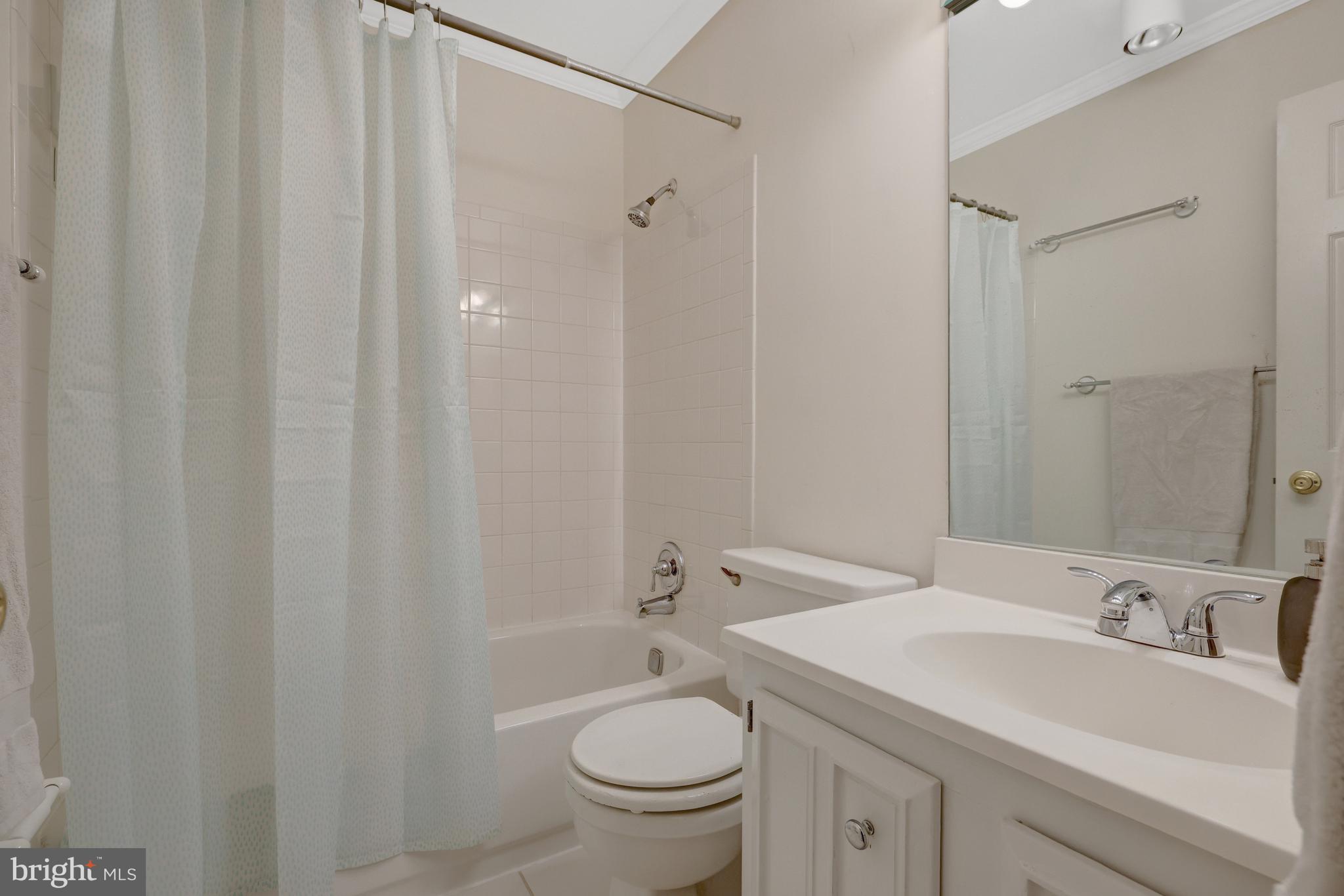 9001 Streamview Lane Vienna, VA 22182 - Photo 41 of 64 a bathroom with a sink a toilet and shower