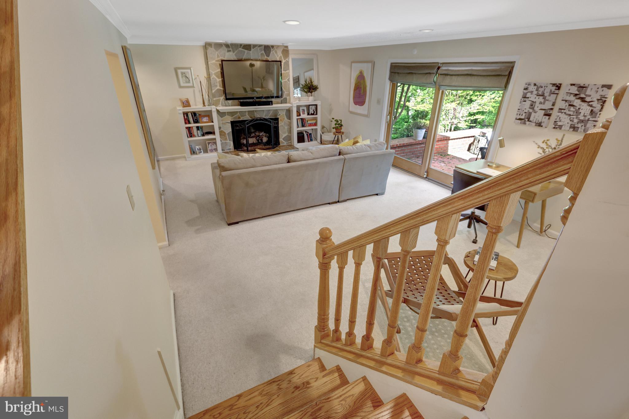 9001 Streamview Lane Vienna, VA 22182 - Photo 42 of 64 a living room with furniture and a flat screen tv