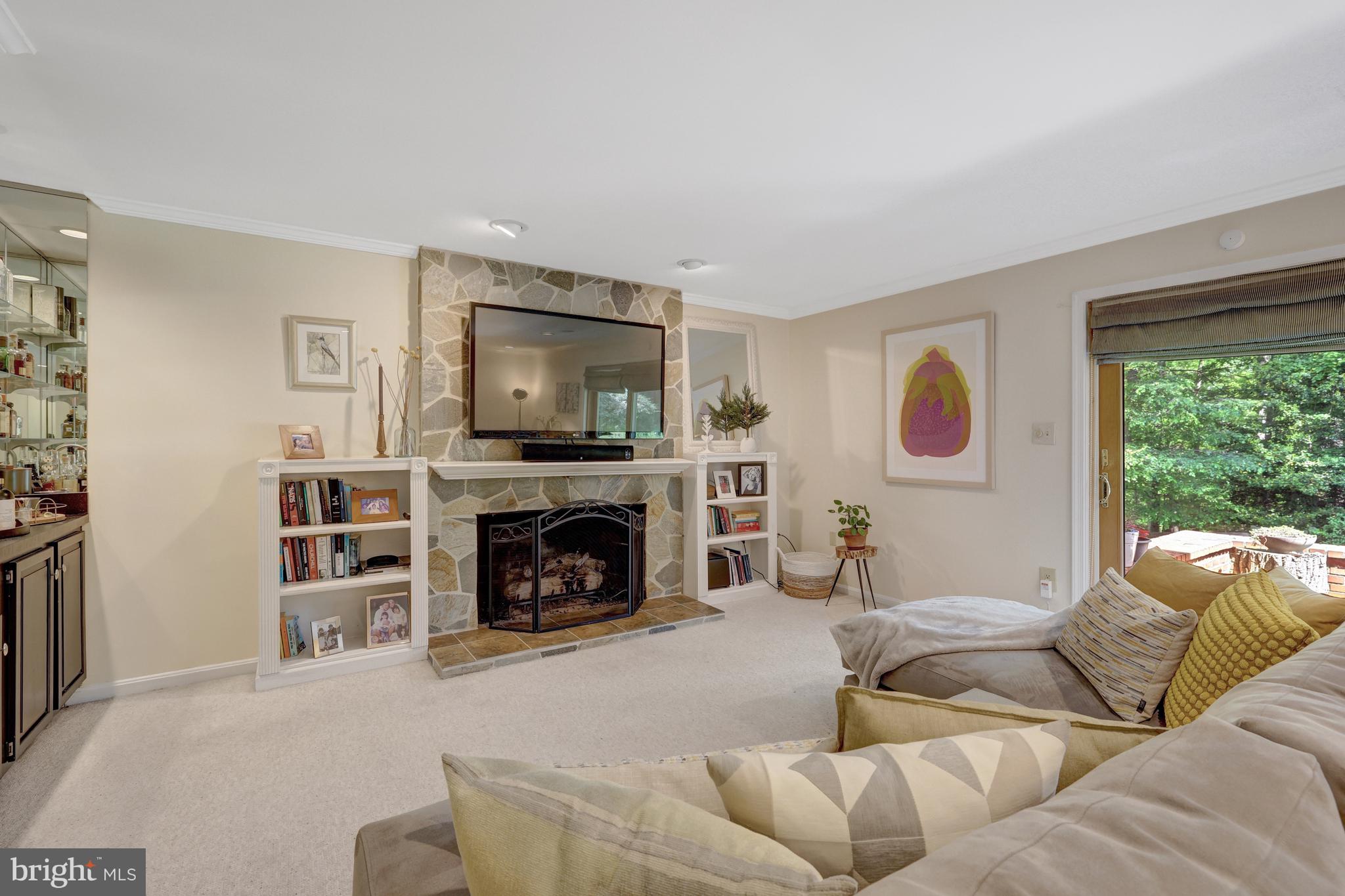 9001 Streamview Lane Vienna, VA 22182 - Photo 45 of 64 a living room with furniture and a fireplace