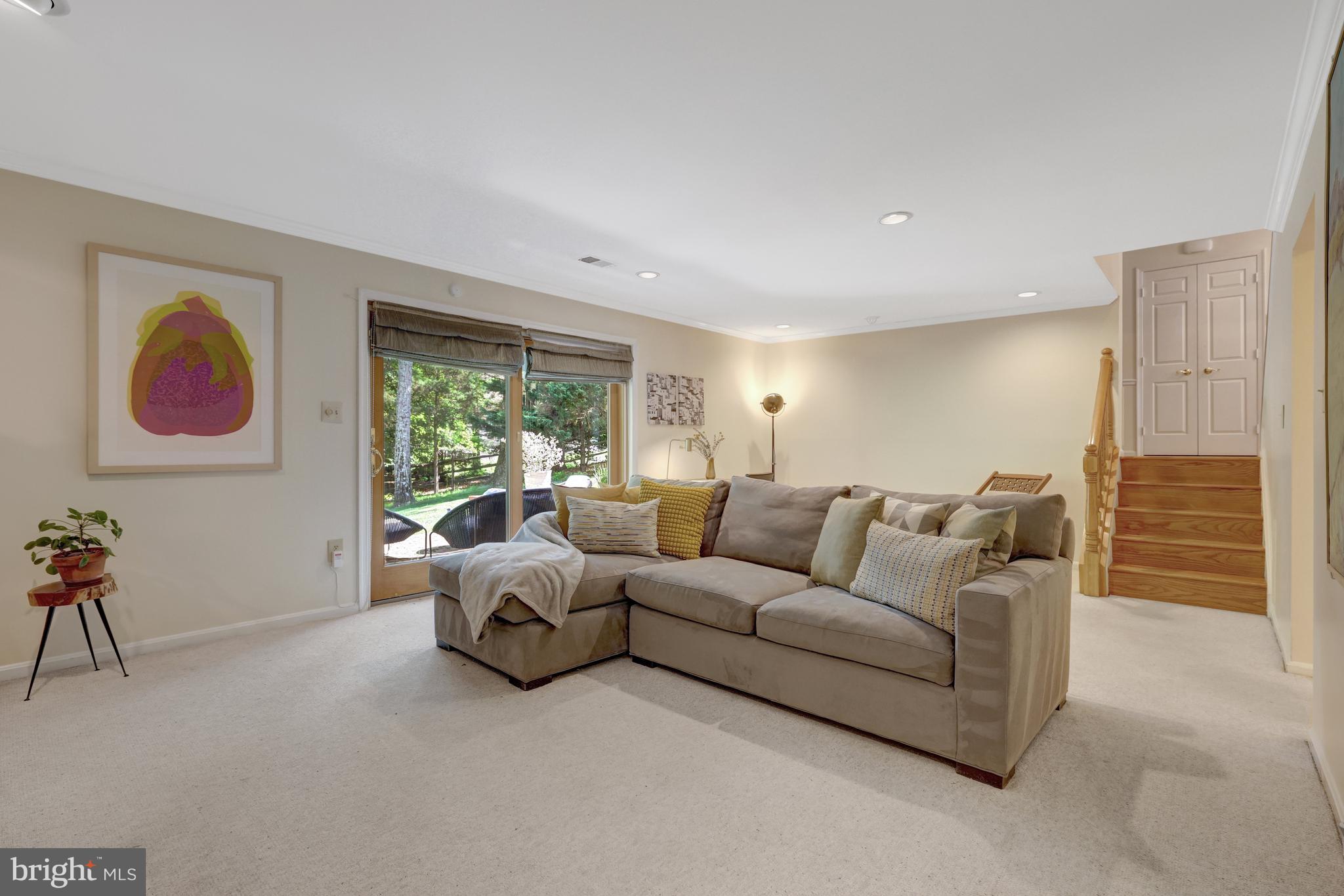 9001 Streamview Lane Vienna, VA 22182 - Photo 47 of 64 a living room with furniture and a large window