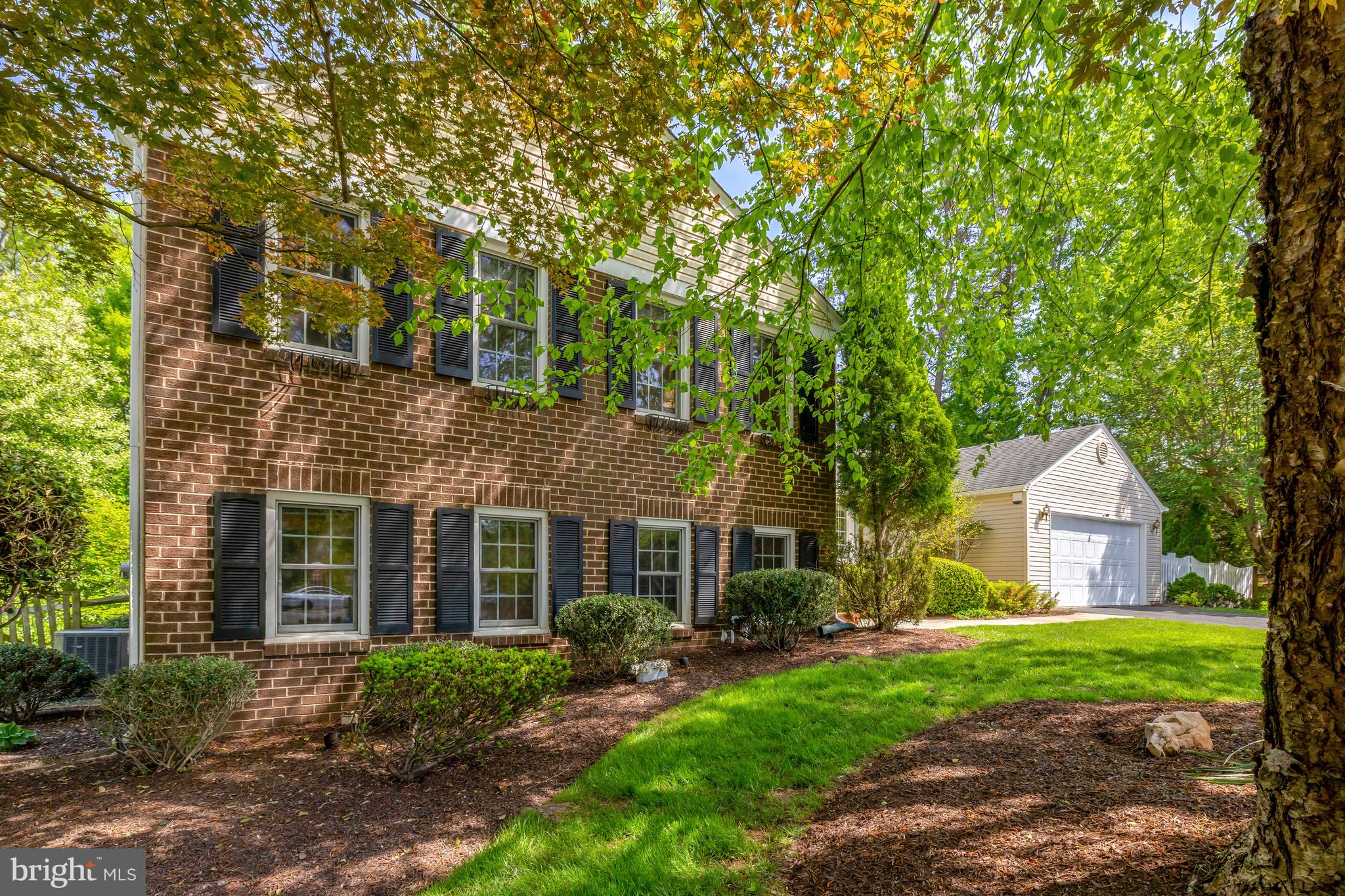 9001 Streamview Lane Vienna, VA 22182 - Photo 5 of 64 a front view of a house with garden