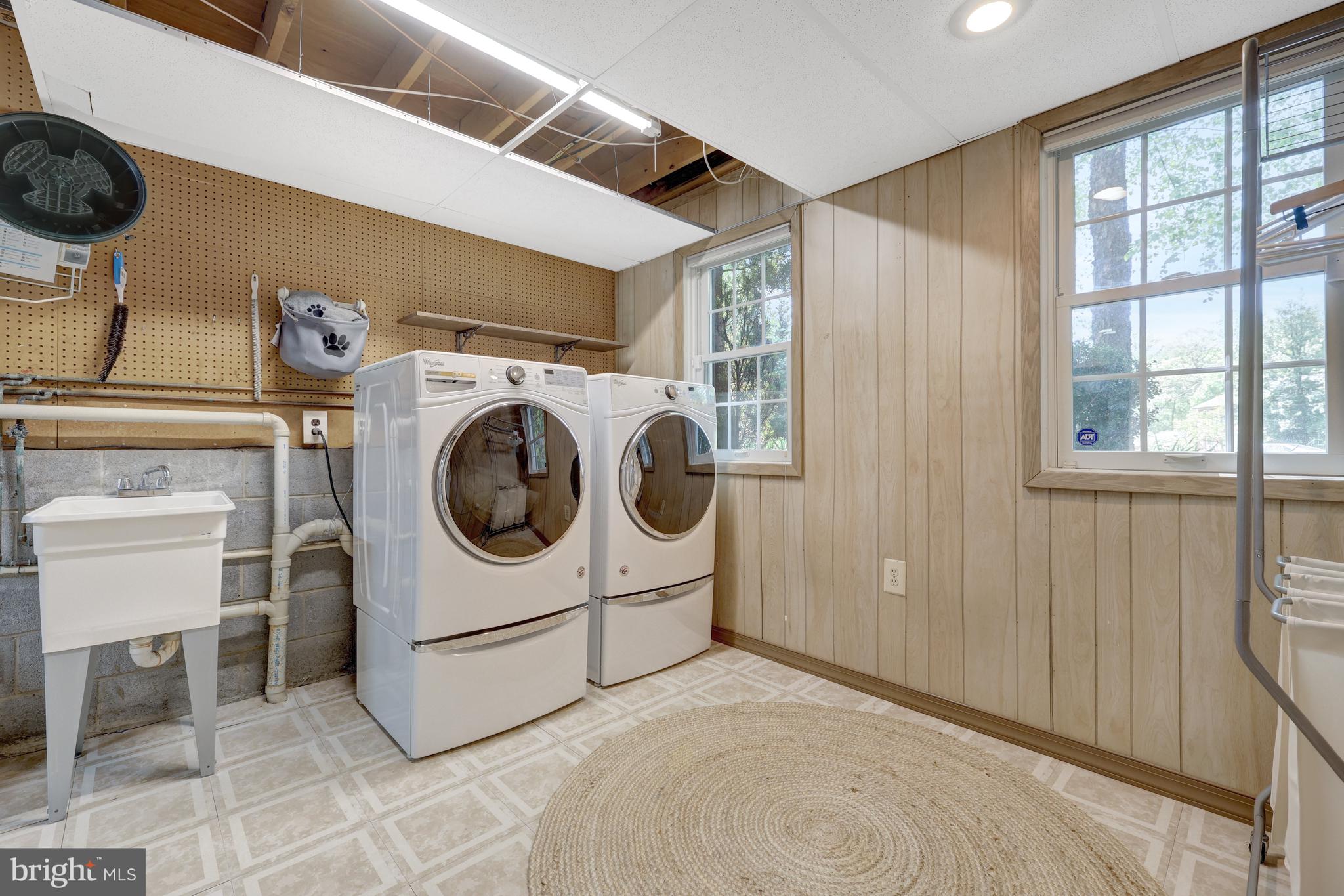 9001 Streamview Lane Vienna, VA 22182 - Photo 51 of 64 a utility room with dryer and washer