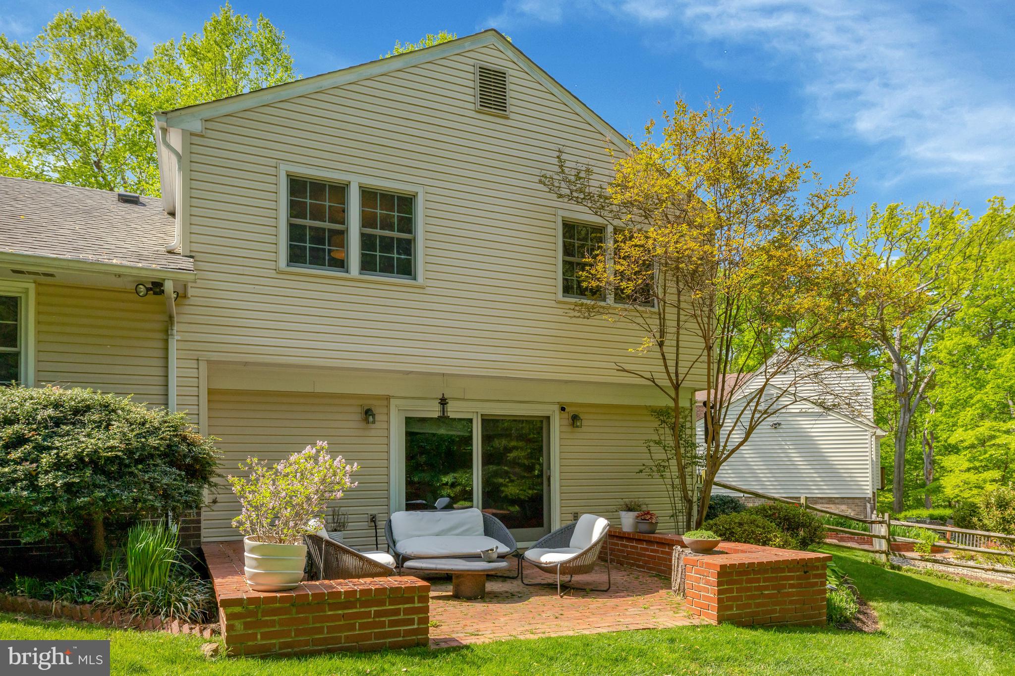 9001 Streamview Lane Vienna, VA 22182 - Photo 53 of 64 a backyard of a house with yard table and chairs