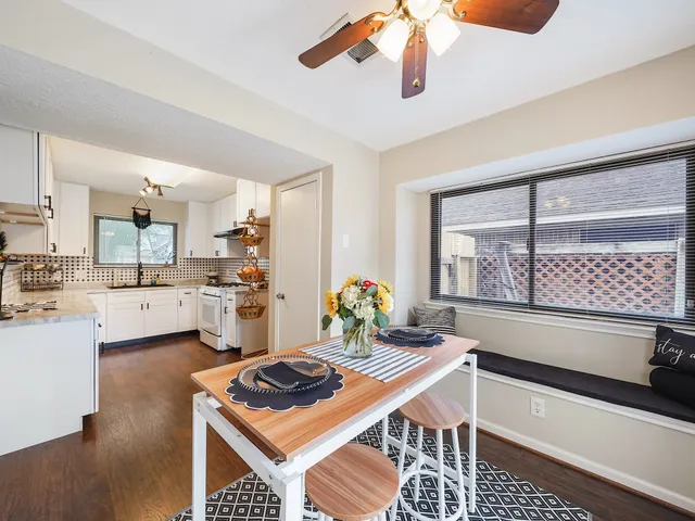 a kitchen with a stove a sink and a refrigerator