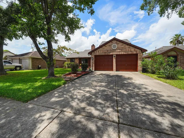 a front view of a house with yard