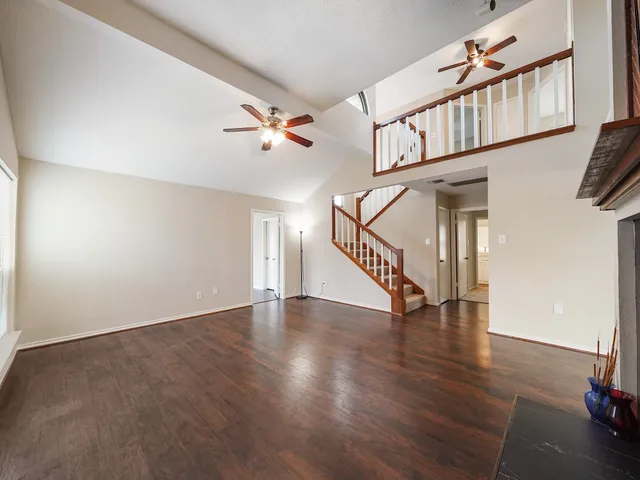 a view of an entryway with wooden floor